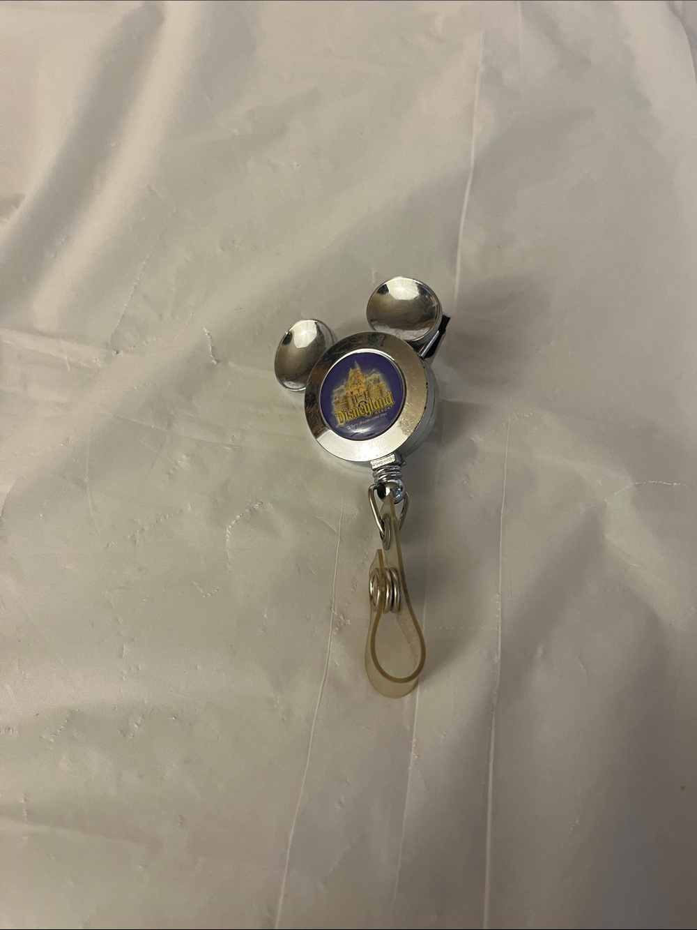 Disneyland Silver Mickey Badge Reel with Blue Logo